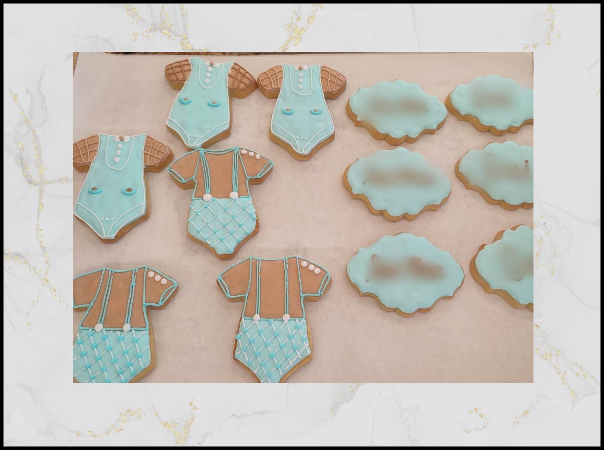 Blue baby shower decorated cookies with pastel bow and baby theme in Macau