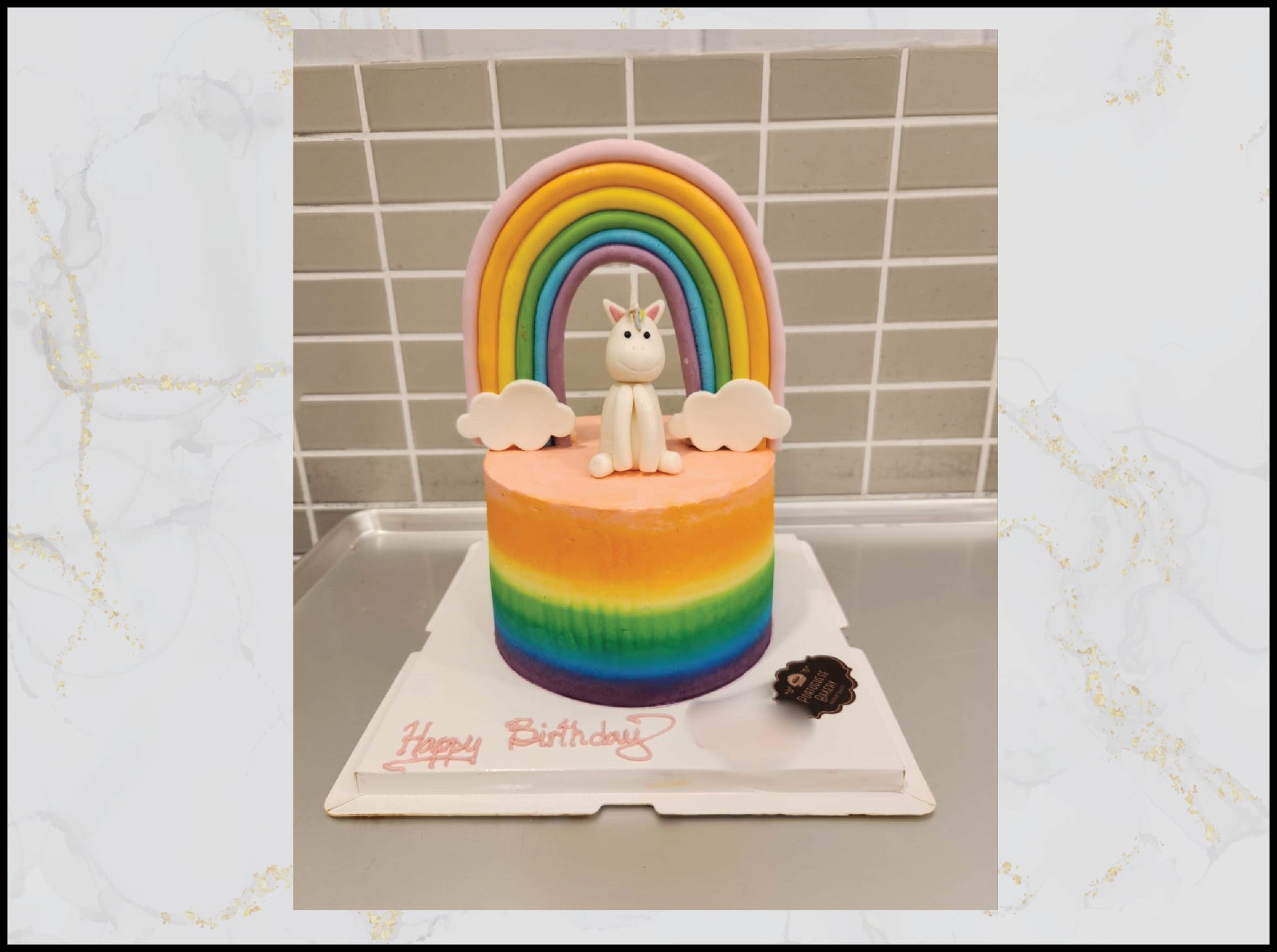 Cute rainbow and unicorn birthday cake with magical colorful design in Macau