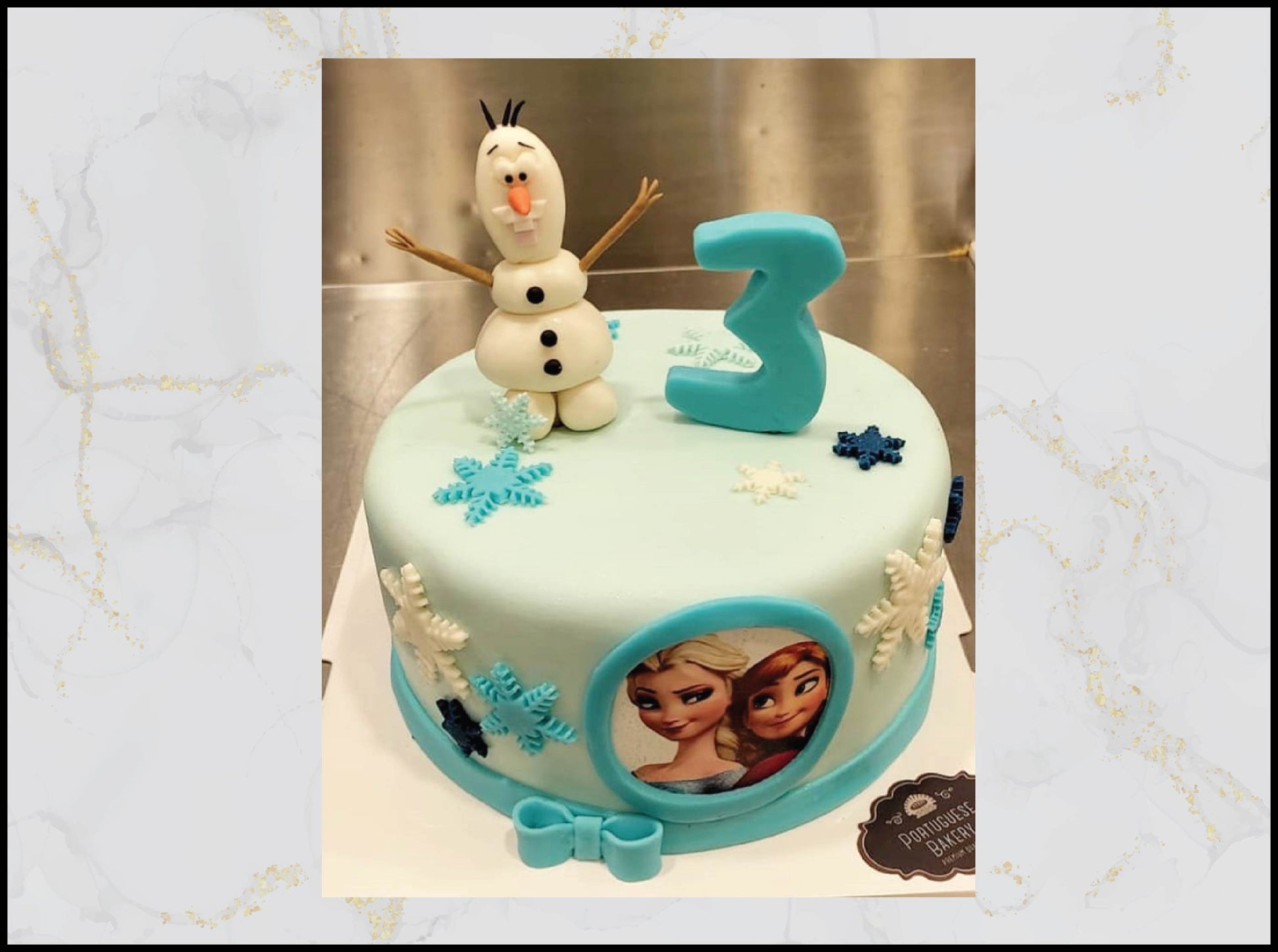 Frozen Olaf birthday cake with cheerful snowman design in Macau