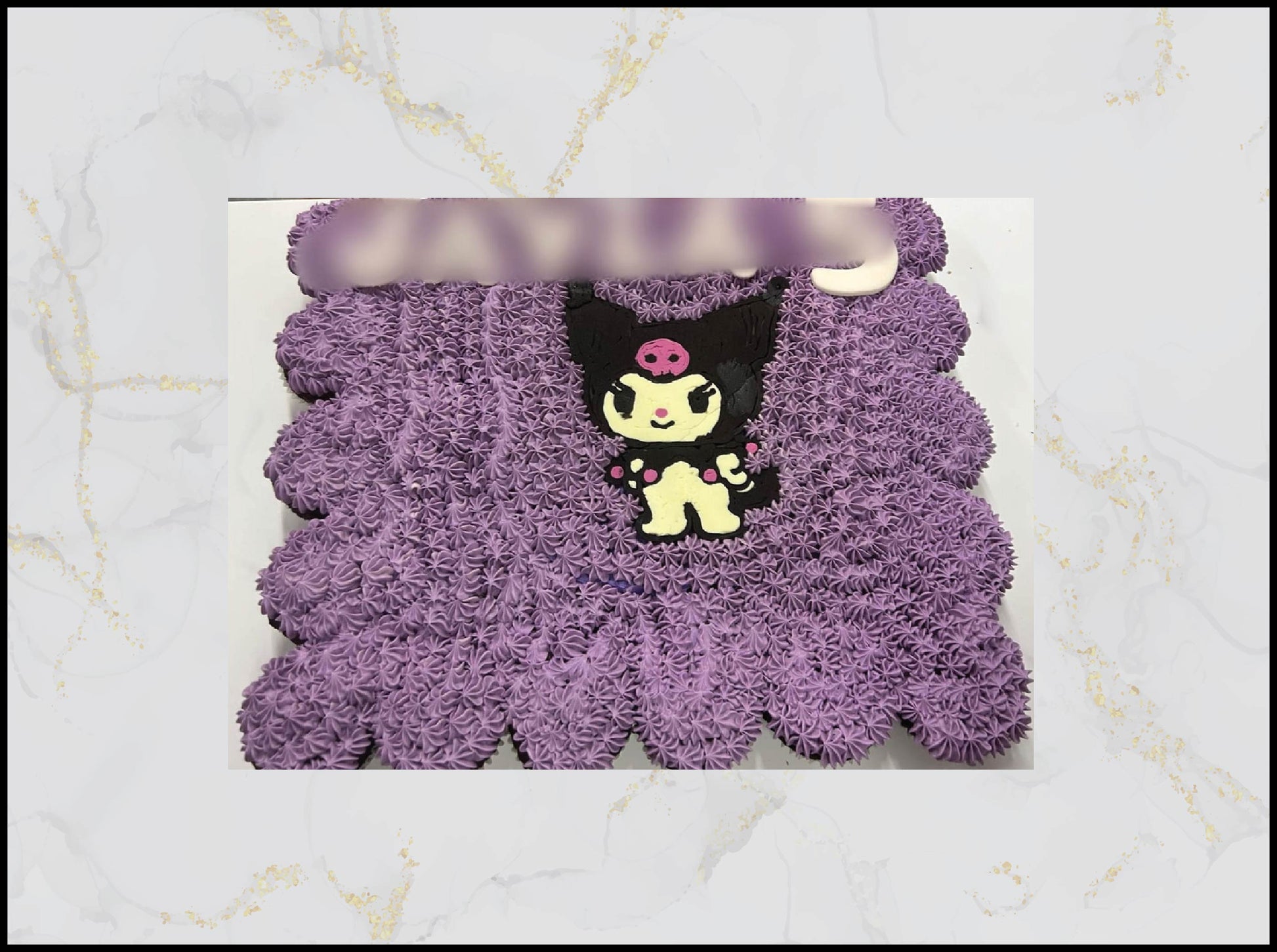 Purple textured cupcakes with a cartoon character macau cake
