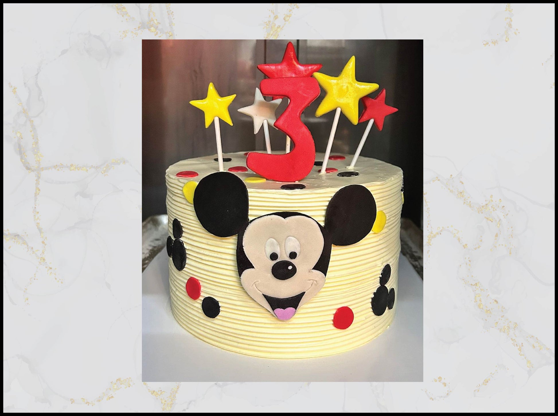 Yellow cake with Mickey Mouse design and birthday candles macau