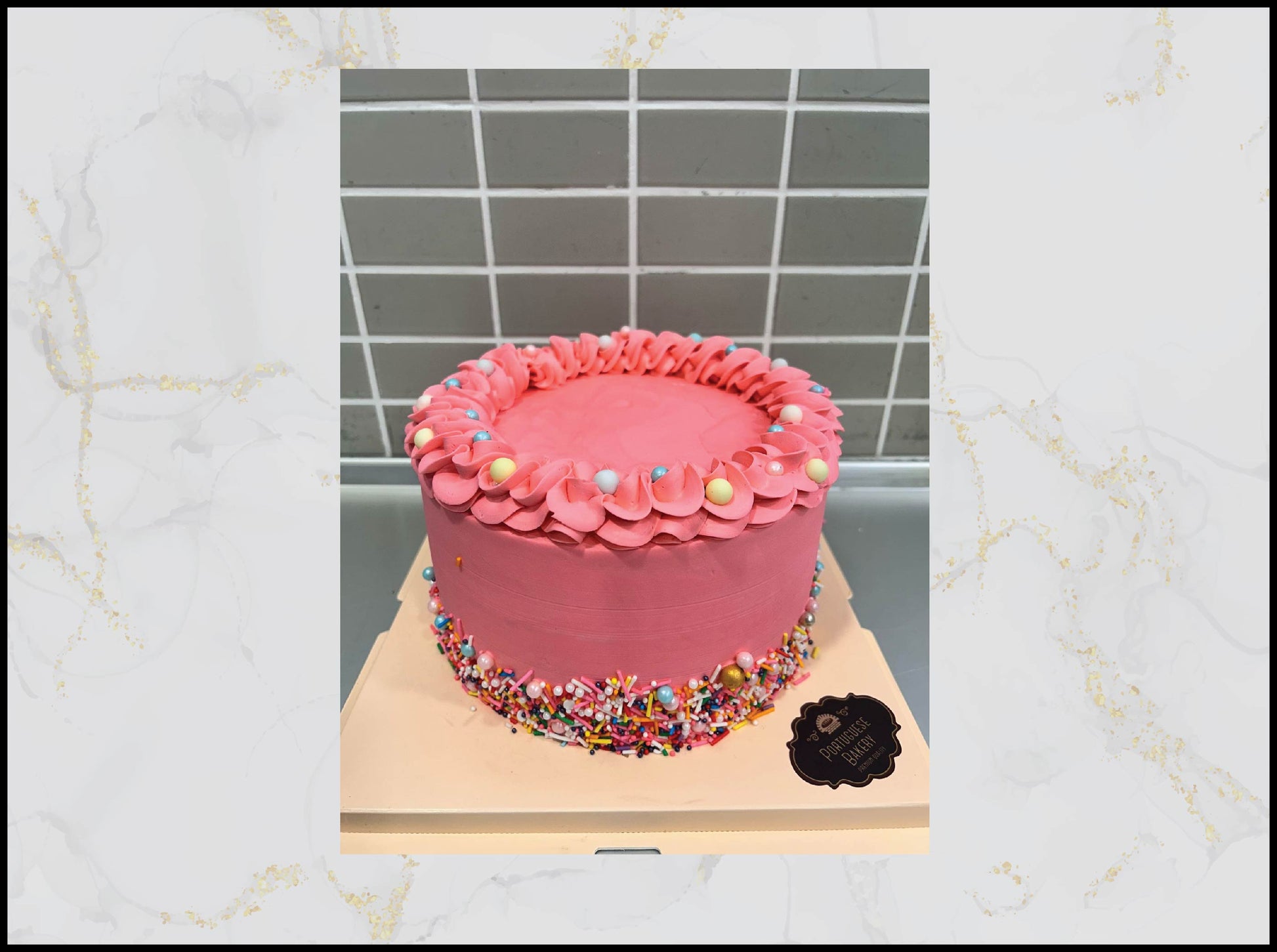 Pink cake with decorative elements macau cake
