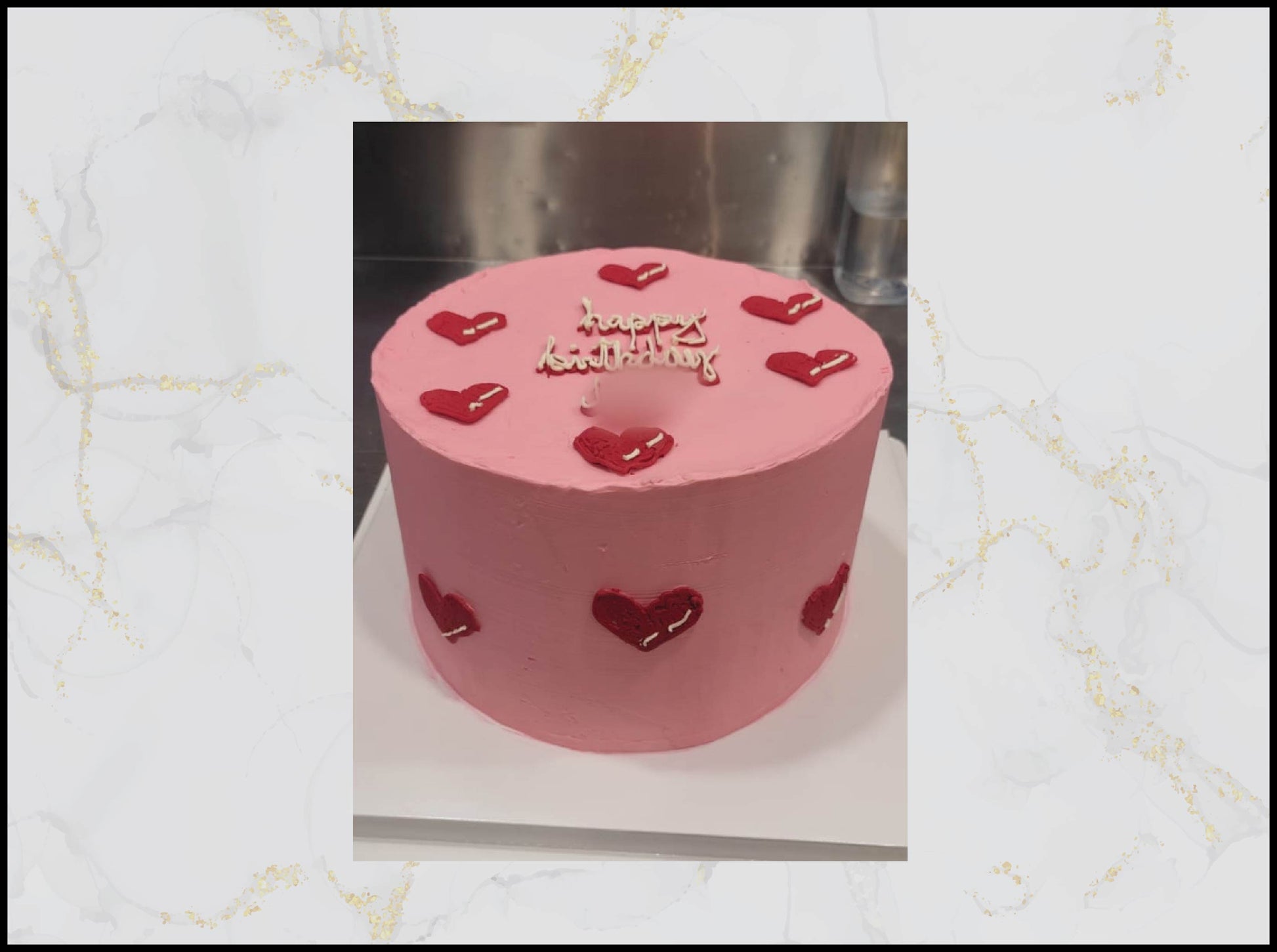 Pink birthday cake with heart designs and 'Happy Birthday' text macau bakery