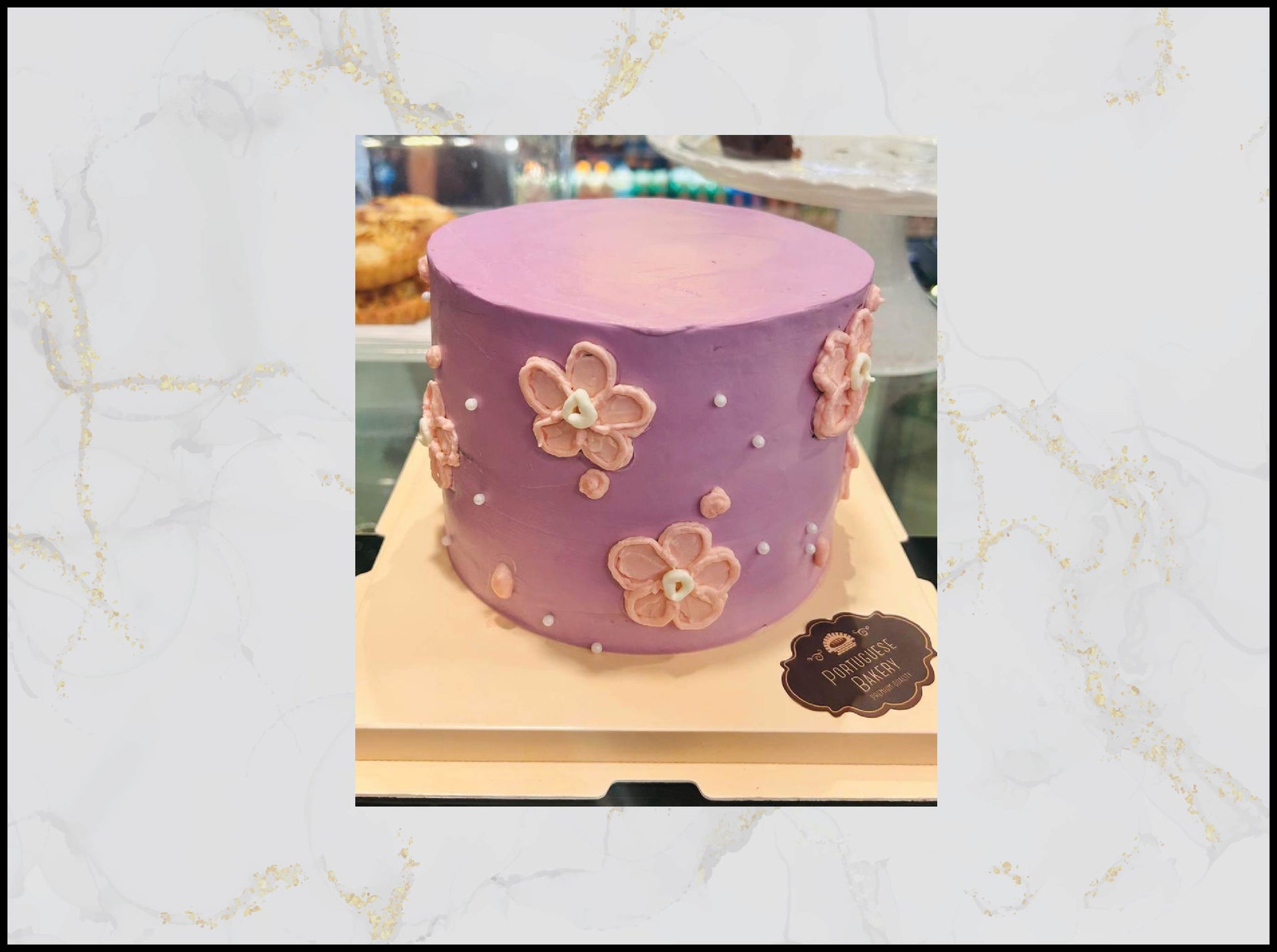 Purple cake with floral decorations macau cake