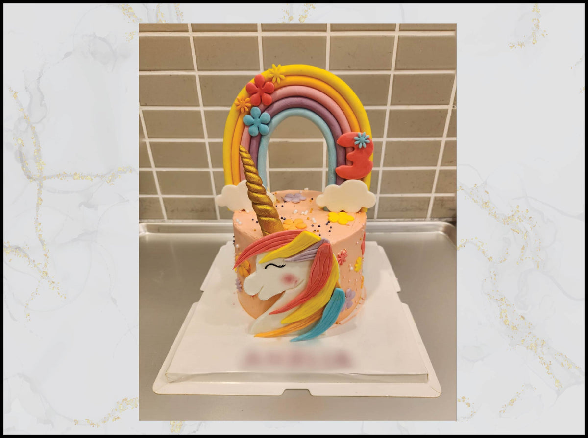 Pink rainbow unicorn birthday cake with magical colorful design in Macau