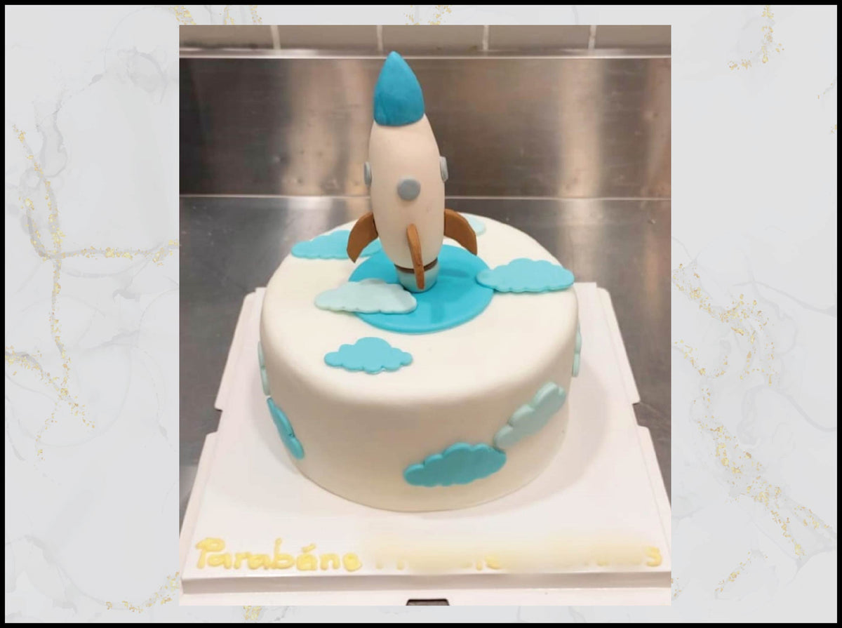 Rocket birthday cake with cosmic space adventure design in Macau