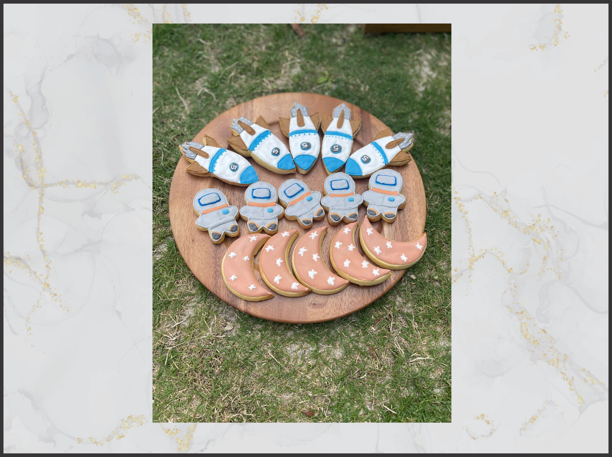 Decorative cookies shaped like space shuttles and planets macau bakery cookies